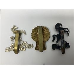Nineteen Yeomanry metal cap badges including Derbyshire, Northamptonshire, Essex, Glamorgan, Staffordshire, City of London, Surrey, Shropshire, Hertfordshire etc; together with eleven Fusiliers badges including Lancashire, Royal Welch, Northumberland etc (30)
