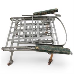 Victorian foldable day bed, button back padded arms, reupholstered in a green fabric with Latin script, turned feet with ceramic castors