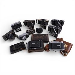 Collection of vintage cameras, including Bakelite Rajar No. 6 and VP Twin, Ferrania Condor...