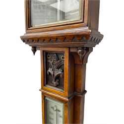 J Hicks - Hatton Garden London, - late 19th century carved oak cased Fitzroy barometer in a richly carved case with a carved crested pediment and square cistern cover, inverted opaline register reflecting FitzRoy's predictions and a scale from 27 to 31 inches of barometric pressure, with a thick bore cistern tube and adjustable rack and pinion twin vernier, fitted with a glazed snail bulb mercury thermometer recording the air temperature in both Fahrenheit and Celsius. Mercury clean and present.
James Joseph Hicks was born in Ireland, however, early in his life he moved to London where he was apprenticed to the instrument maker Louis P Casella. In 1860 he went into business in his own right as a scientific instrument maker at 8 Hatton Gardens. In 1864 he was granted membership to the British Meteorological Society and exhibited instruments at the Royal Society Exhibitions between 1876 and 1913. Hicks was one of London's most prolific and eminent barometer makers. 