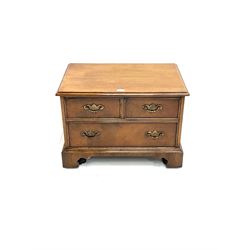 20th century walnut television stand, fall front opening as three faux drawer, enclosing fitted interior,  bracket supports 