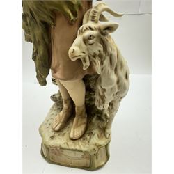 Pair of Royal Dux figures, no. 1115, modelled as a shepherd with a goat by his side and a shepherdess feeding a lamb, each wearing flowing green and pink robes with gilt detailing, with pink triangle mark beneath, H51cm