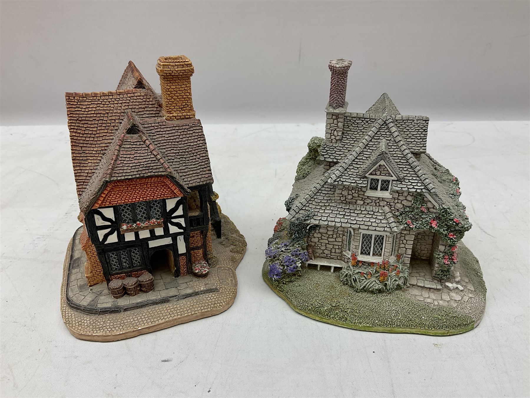 Eleven Lilliput Lane models, to include St Marks, Rose Cottage, Puffin Row, Village School, Swan Inn etc, all boxed