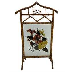 Victorian bamboo fire screen, pointed arched cresting rails over floral painted glass panel 