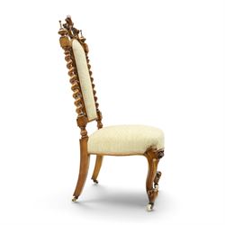 Victorian carved walnut side chair, the ornate high back with pierced and carved scrolled cartouche cresting rail, the back panel and sprung seat upholstered in sage green fabric, flanked by scrolling acanthus leaves and spiral turned pilasters, raised on scroll carved cabriole legs with ceramic castors