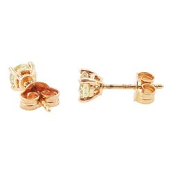 Pair of 18ct rose gold fancy yellow diamond earrings, each stud four claw set with a round brilliant cut diamond, stamped 750, total diamond weight approx 1.00 carat