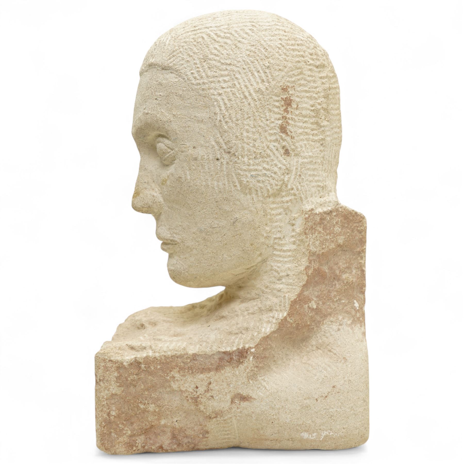 Modern carved limestone slab sculpture of the head of a man, H38cm 