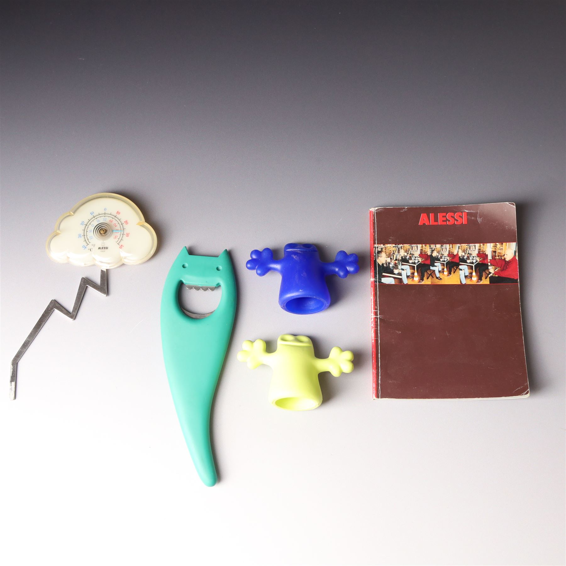 Collection of Alessi items, comprising a 'Juicy Salif' lemon squeezer designed by Philippe Starck, a condiment set designed by Ettore Sottsass, two 'Carlo - a ghost on top of a bottle' designed by Mattia Di Rosa, and further items, all stamped (10)