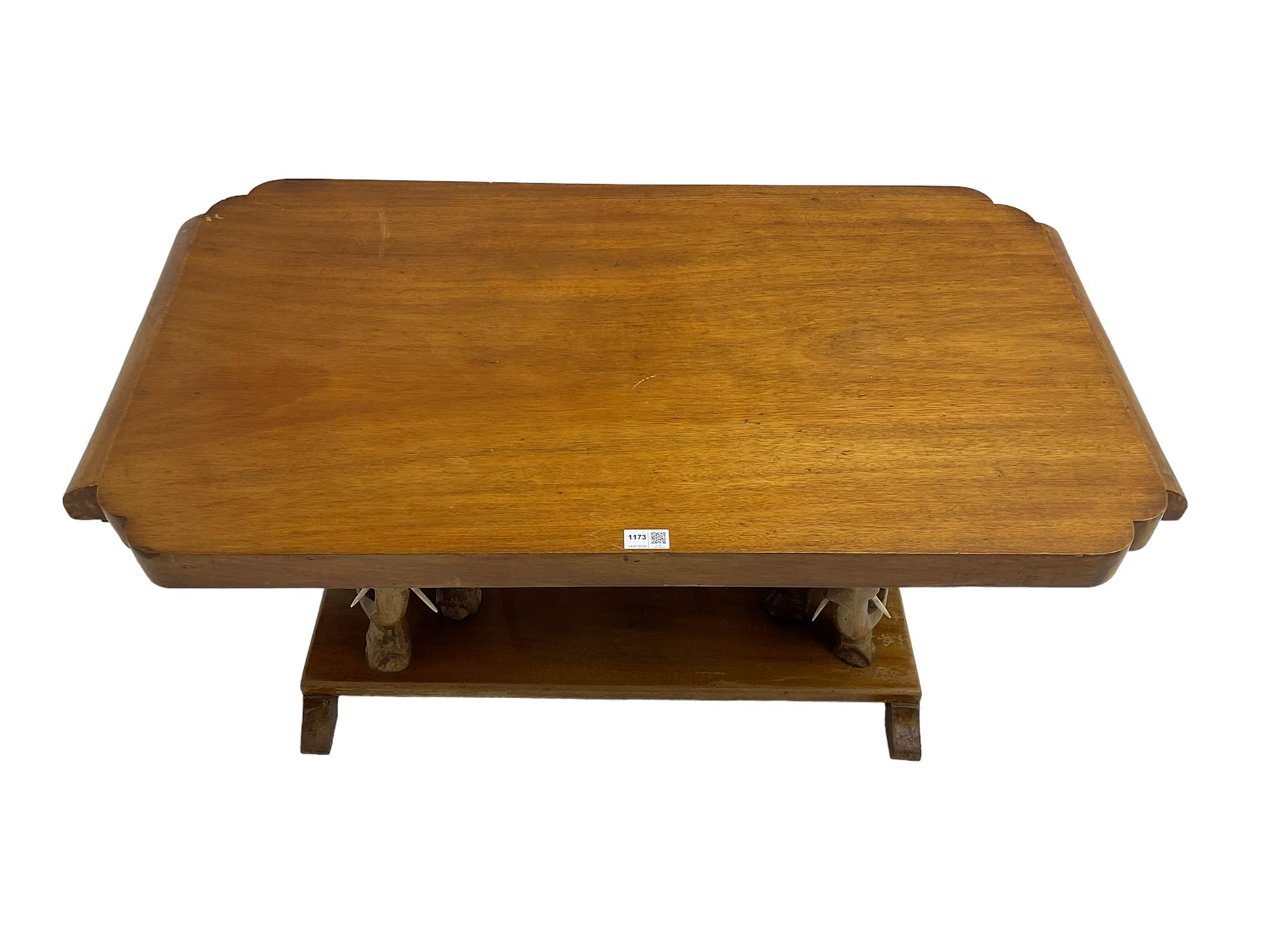 Hardwood coffee table on carved elephant figure supports, platform base on sledge feet