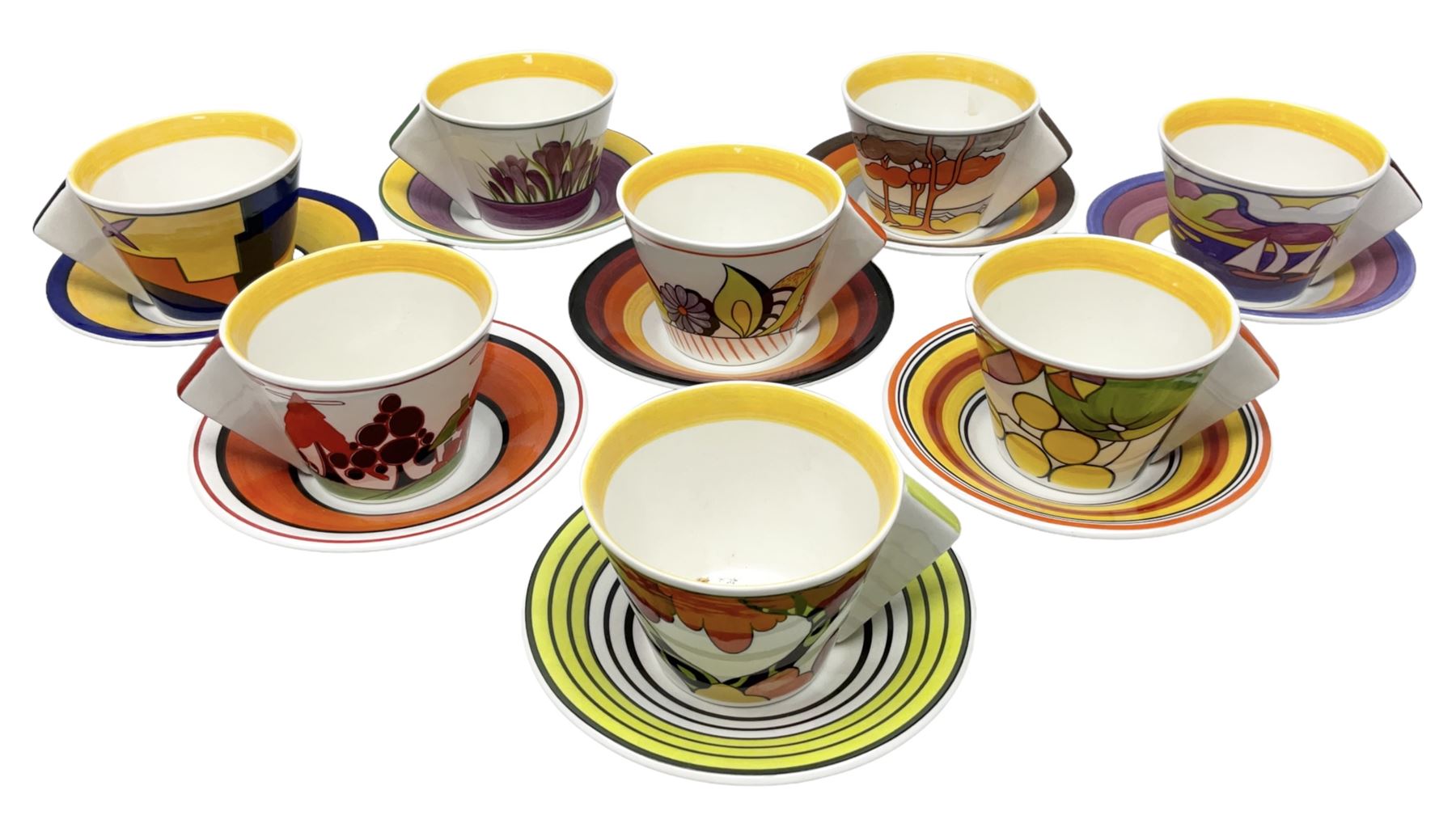 Wedgwood limited edition Clarice Cliff Design Taking Tea collection, comprising eight cups and saucers Honolulu, Apples, Gibraltar, Lilac Crocus, Trees and House, Coral Firs, Devon, and Sunray, with certificates of authenticity 