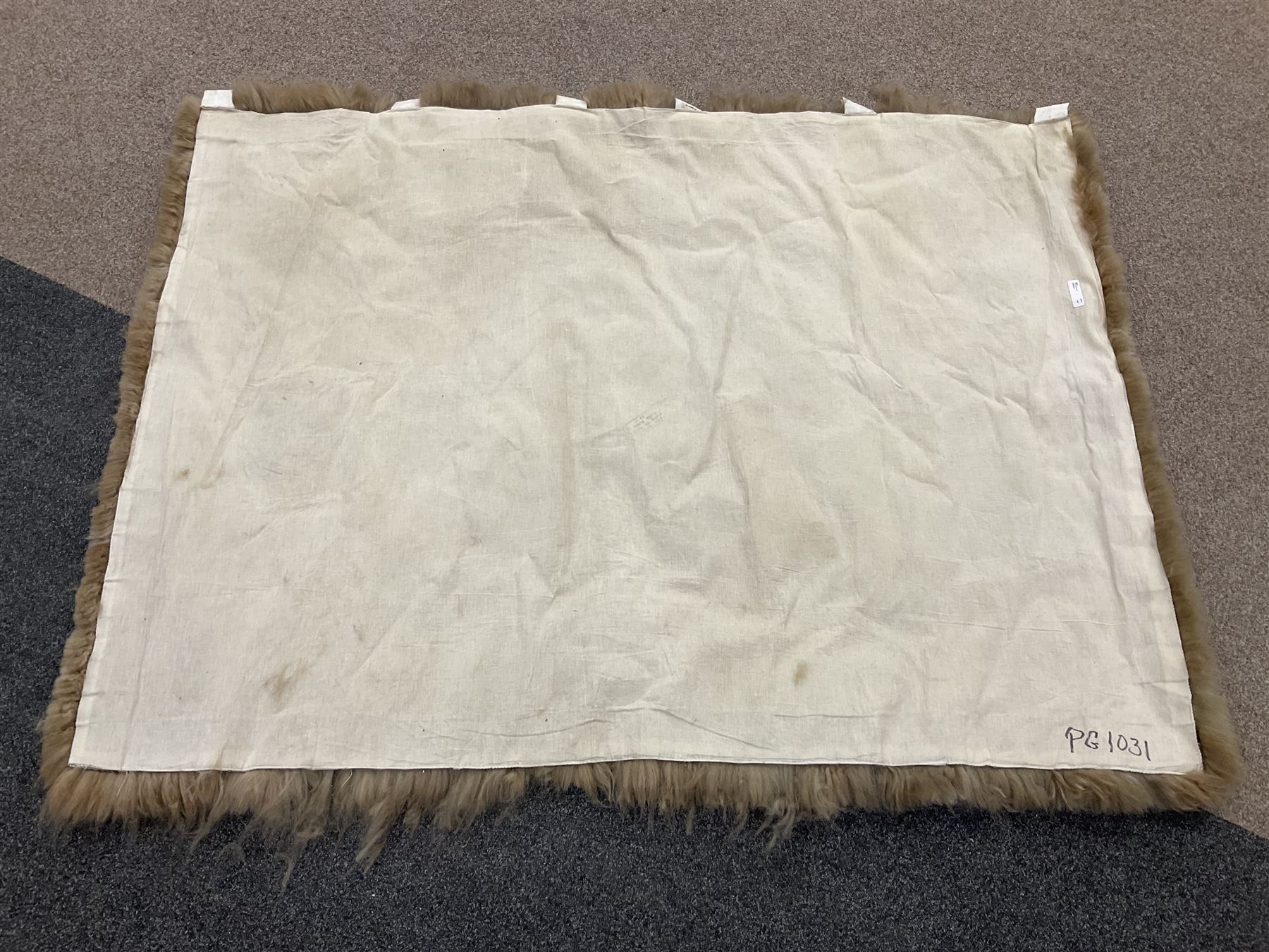 Alpaca rug/wall hanging depicting a gorilla on a cream background 