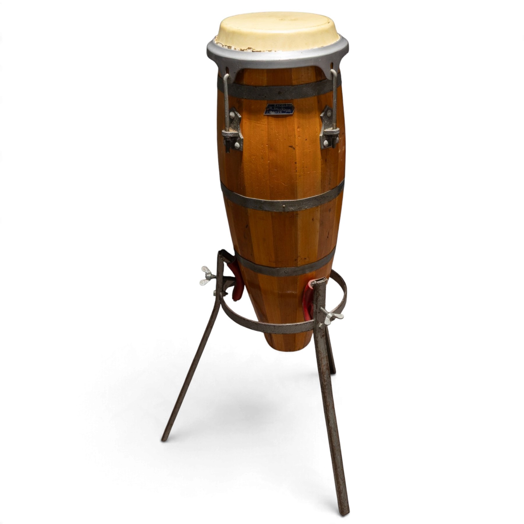 Three conga drums, comprising two Excelsior A. Salvadori Firenze stave-built wooden congas and one similar French example, with skin heads and metal tension mounts, on metal stands with hard carry cases for drums, tallest H79cm, D31cm