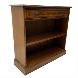 Georgian design low open bookcase, figured top with crossbanding and feather stringing, fitted with single cock-beaded drawer over a single adjustable, on skirted base