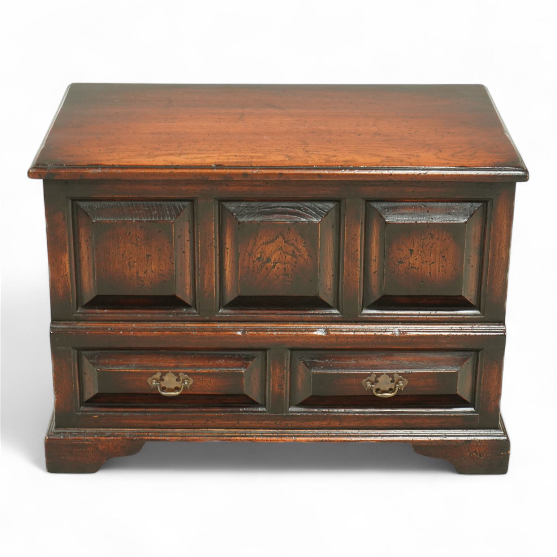 Titchmarsh and Goodwin design miniature oak coffer, rectangular, removable top with projecting panelled front with blind drawers on bracket feet 