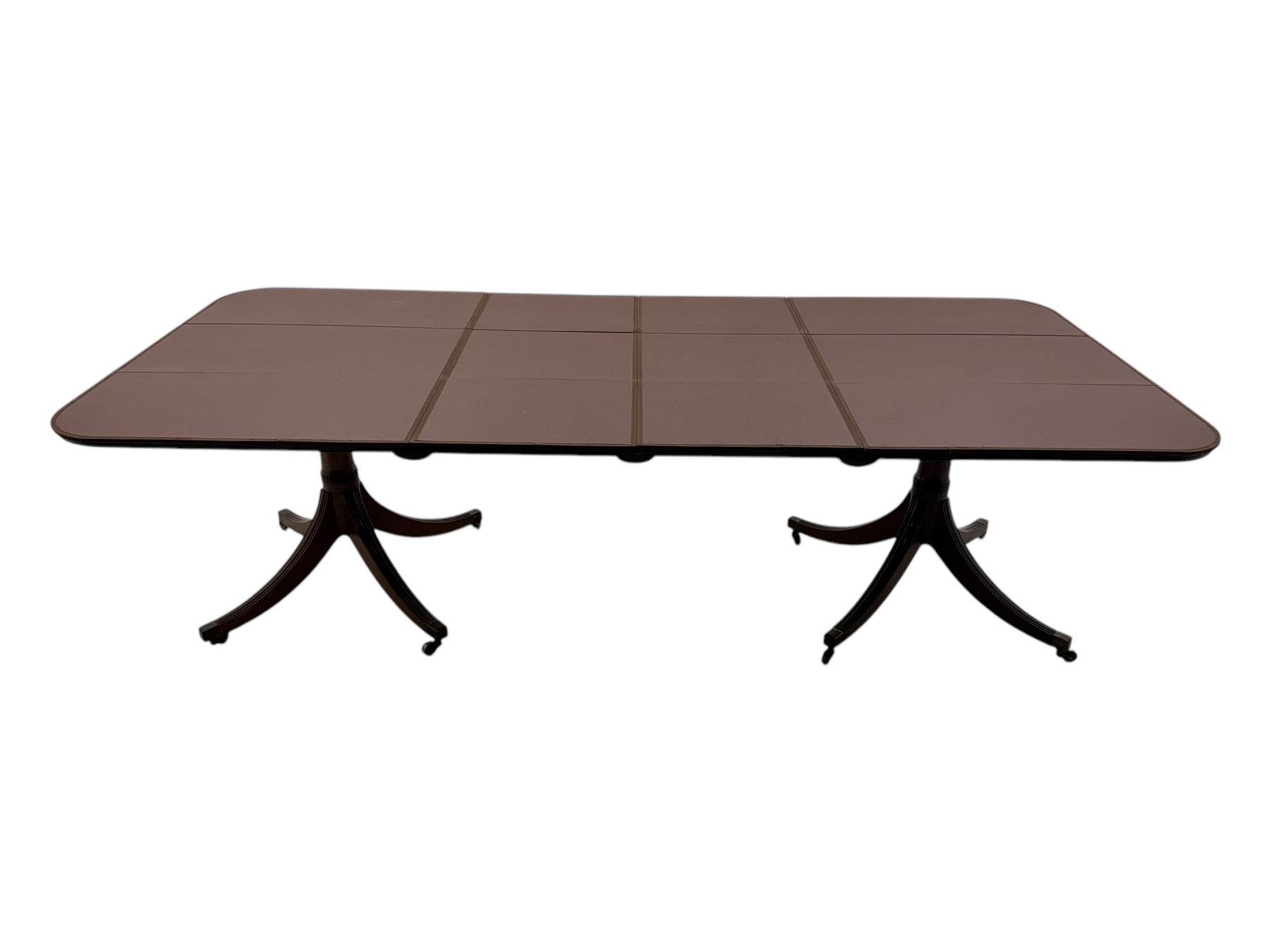 Regency design mahogany twin pillar dining table, two additional leaves, on turned supports with four out-splayed supports 