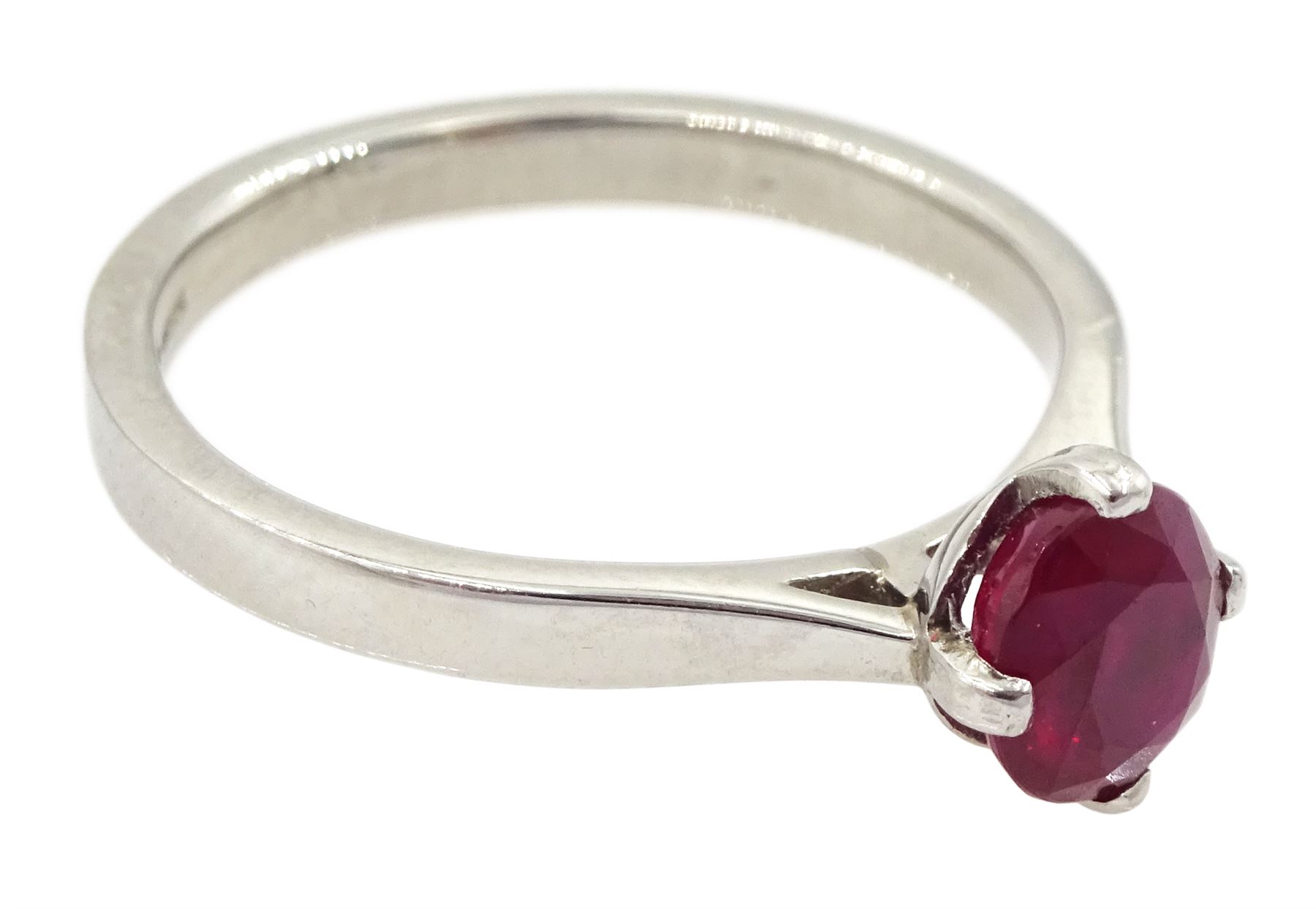 Platinum ruby ring, four claw set with a single oval cut ruby of approx 1.00 carat hallmarked