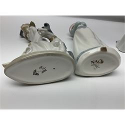 Eleven Nao figures to include Cowboy, Girl with Puppy, Clown, Girl in hat etc 