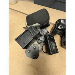Panasonic Lumix DMC-LF1 digital camera, with charger and instruction booklet, together with a Minolta Dynax 5000i SLR camera body with a Minolta AF Zoom 35-80mm 1:4 (22)-5.6 lens, and a Fujifilm Finepix T digital camera