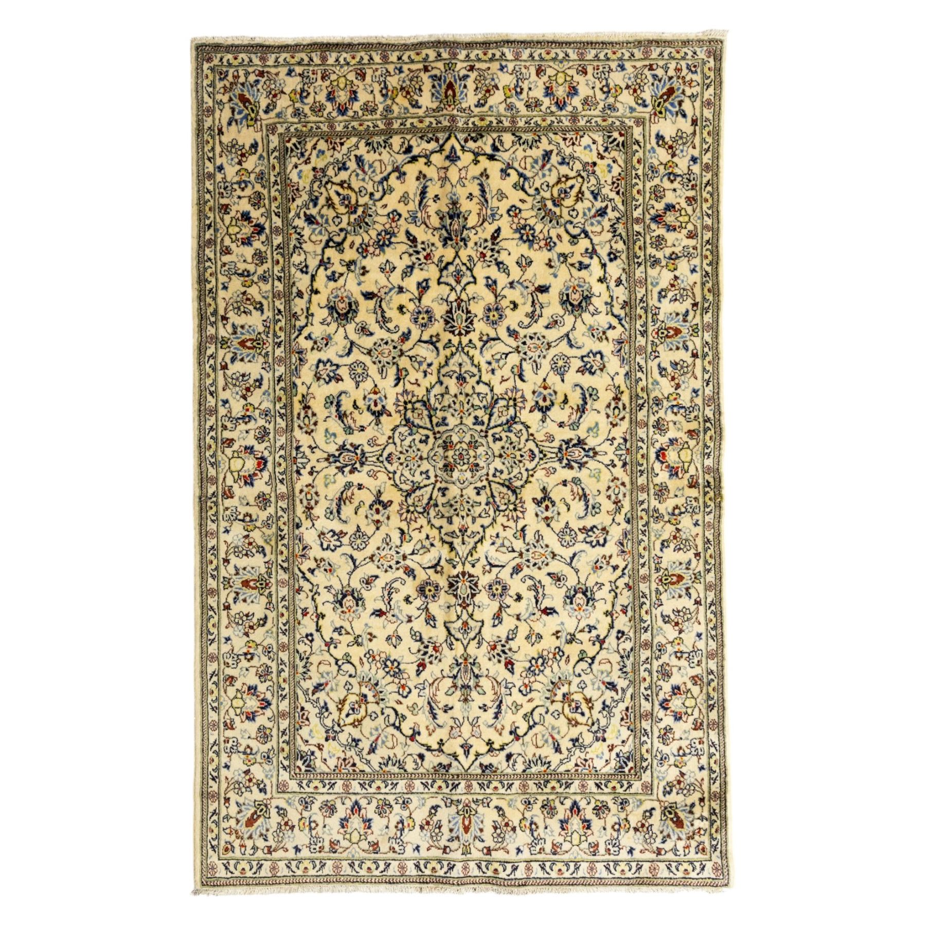 Central Persian Kashan hand-knotted rug, ivory ground, with a small central floral medallion and pendants, the field finely decorated with blue, cream and soft red scrolling vines, flowerheads and palmettes, within an ivory floral border and narrow guard stripes, with cotton fringes