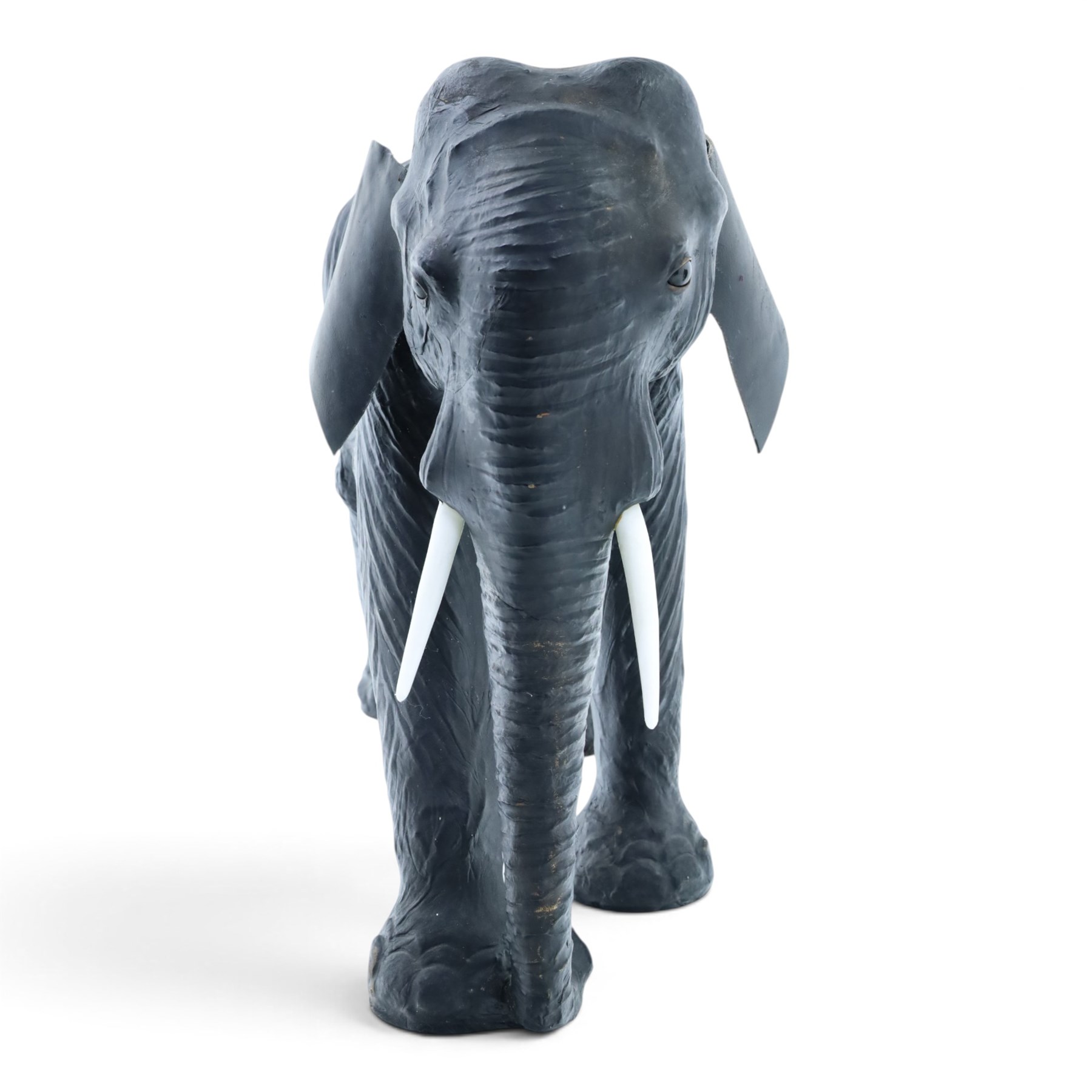 In the style of Liberty & Co - pair of 20th century ebonised leather elephants