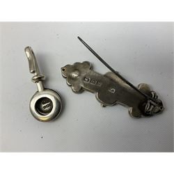 Group of silver, to include filled figure of a pheasant, hallmarked for London, pair of silver mounted horn napkin rings, miniature Edwardian bible with silver cover embossed with putti, Victorian silver brooch, ebonised plinth with applied inscribed silver shields, etc., together with two stick pins, one example with 9ct gold terminal 