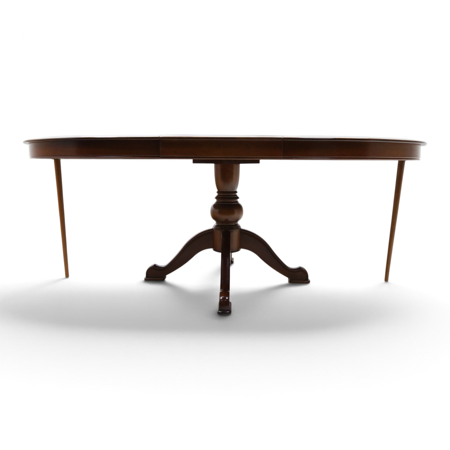 Barker & Stonehouse - cherrywood oval extending dining table and four upholstered chairs, the table with additional leaf extended to cm, raised on a turned column above swept supports, the chairs with brown upholstery and multi-coloured geometric design