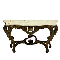 French Rococo design console or pier table, shaped and moulded pale marble top, the apron carved with pierced shell and scrolling acanthus leaves, extending flower head decoration, on four acanthus carved cabriole supports with scrolled terminals, united by shell moulded stretcher rails with central scrolled foliage cartouche 