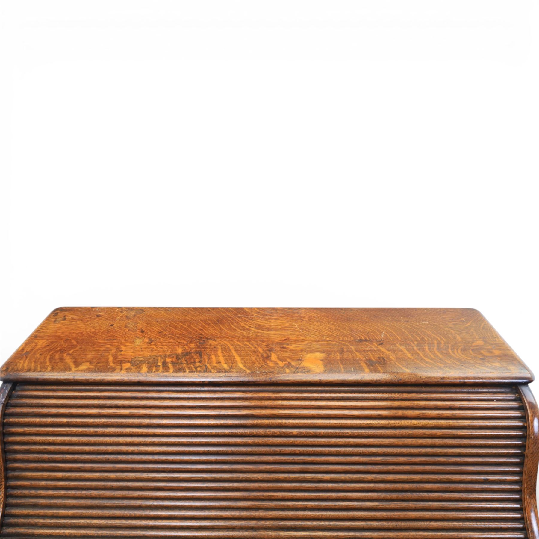 Globe Wernicke - Oak roll top desk, tambour roll top enclosing a fitted interior, raised on two pedestal bases with fitted drawers, raised on a plinth base 