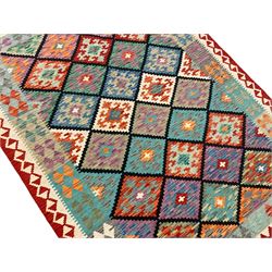 Anatolian Turkish Kilim multi-colour rug, decorated with all over lozenges in contrasting colours with dark indigo outline, the multi-band ivory and red border with repeating geometric shapes and small lozenges or diamonds