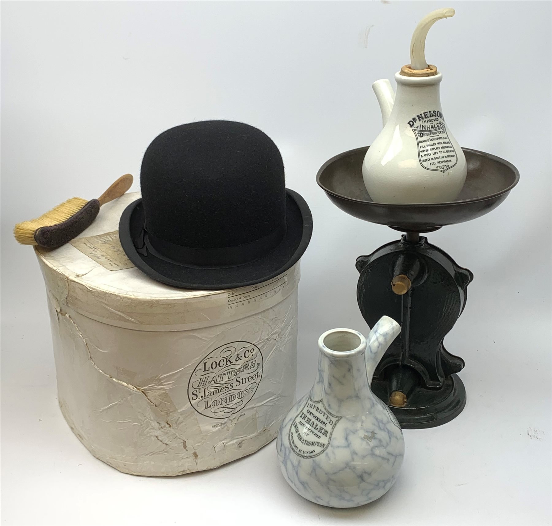 A boxed Lock & Co Hatters St James St London bowler hat, together with a set of Salters cast iron scales with circular brass dial inscribed 'Salters Improved Family Scale, No 50', an early 20th Century Improved Earthenware Inhaler manufactured by S Maw & Son, and a Dr Nelson's Improved Inhaler with stopper. 
