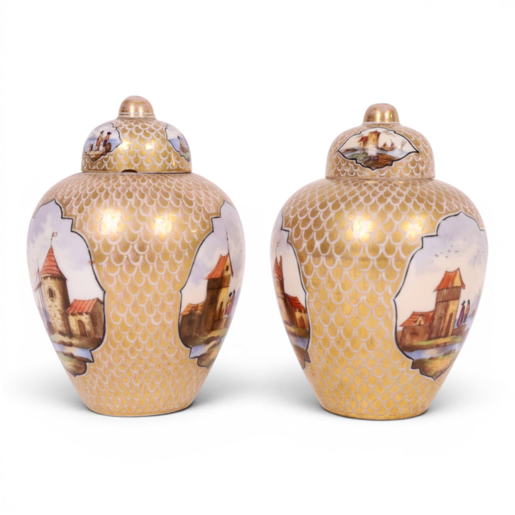 Pair of 19th century Dresden urn and covers, the central panels decorated with figures in landscapes, surrounded by gilt decoration, H15cm 