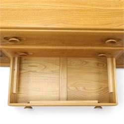 Ercol - mid-20th century light elm and beech Windsor 'model 455' sideboard, rectangular top over three central drawers flanked by cupboards, on castors