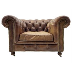 HALO - Chesterfield style armchair upholstered in buttoned brown leather with stud work, on turned feet with castors