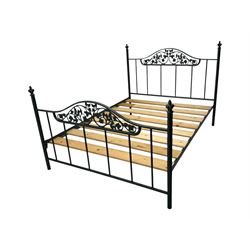 Contemporary metal double bed frame, shaped head and footboards with foliate cast panels and vertical rod supports, the corner posts with urn-shaped finials, finished in a mottled verdigris-style green, with pine slatted base