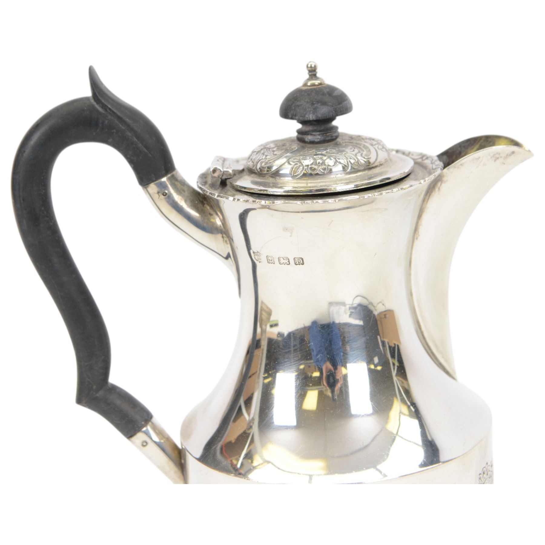 1920s silver hot water pot, with chased and repousse decoration to body depicting pheasants and rabbits in a countryside setting, with Bakelite type handle and finial, upon three palmette mounted feet, hallmarked S Blanckensee & Son Ltd, Birmingham 1928, H22cm