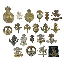 Fourteen cap badges of Irish interest including Royal Dublin Fusiliers inscribed to the slider 'From A. O'Connor 2nd Batt. Dec.2nd 1915', Connaught Rangers, South irish Horse Yeomanry, Inniskilling Fusiliers, Royal Irish Regiment etc; and seven Welsh badges including South Wales Borderers, Welsh Guards, 3rd Bn. Monmouthshire Regt. etc (21)