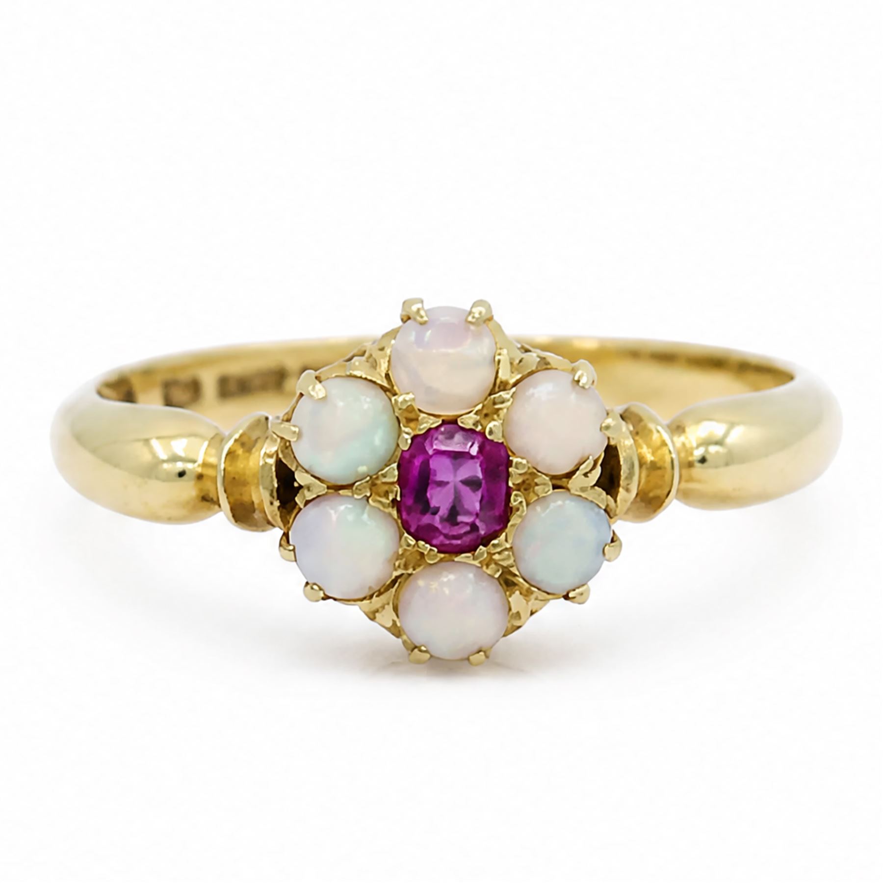Edwardian 18ct gold ruby and opal flower head cluster ring, single oval cut ruby, surrounded by six round cut opals, Birmingham 1902, boxed