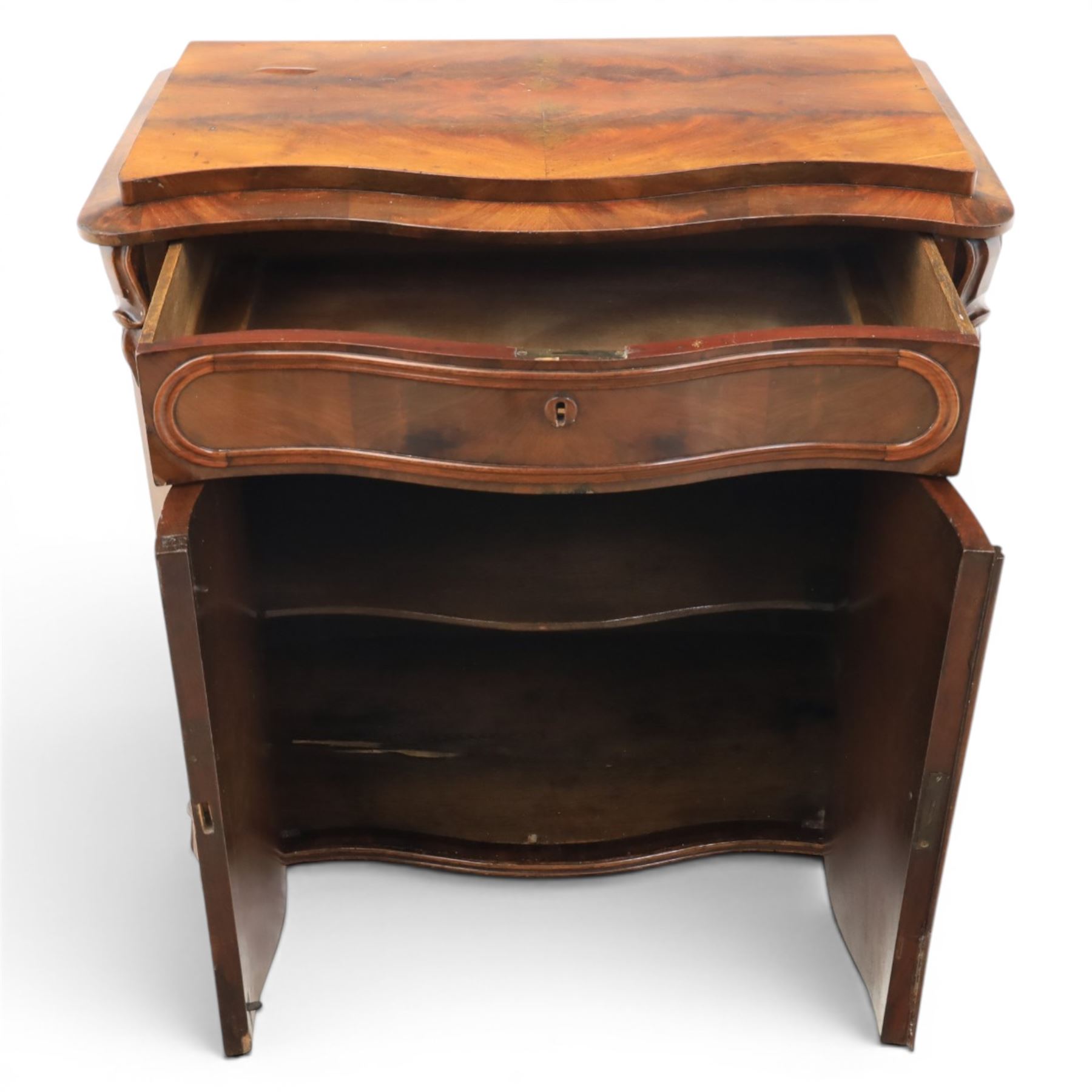 Victorian mahogany chiffonier, with serpentine front and book-matched veneered top, over a frieze drawer and cabinet, raised on pad feet