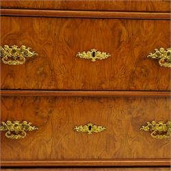 Tall late 19th century walnut chest, stepped and moulded top over six drawers, ornate cast gilt metal handles, enclosed by turned and fluted upright columns, on turned front feet 