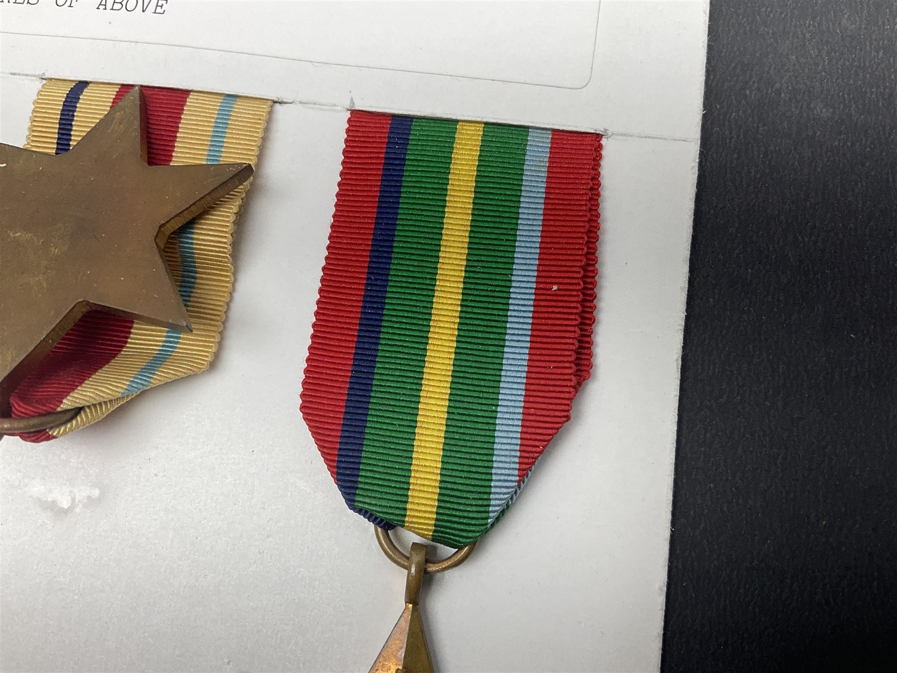 Representative display of WWII Campaign stars comprising 1939-1945 Star, Atlantic Star, Air-Crew Europe Star, Africa Star and Pacific Star; together with the corresponding group of miniatures; all with ribbons