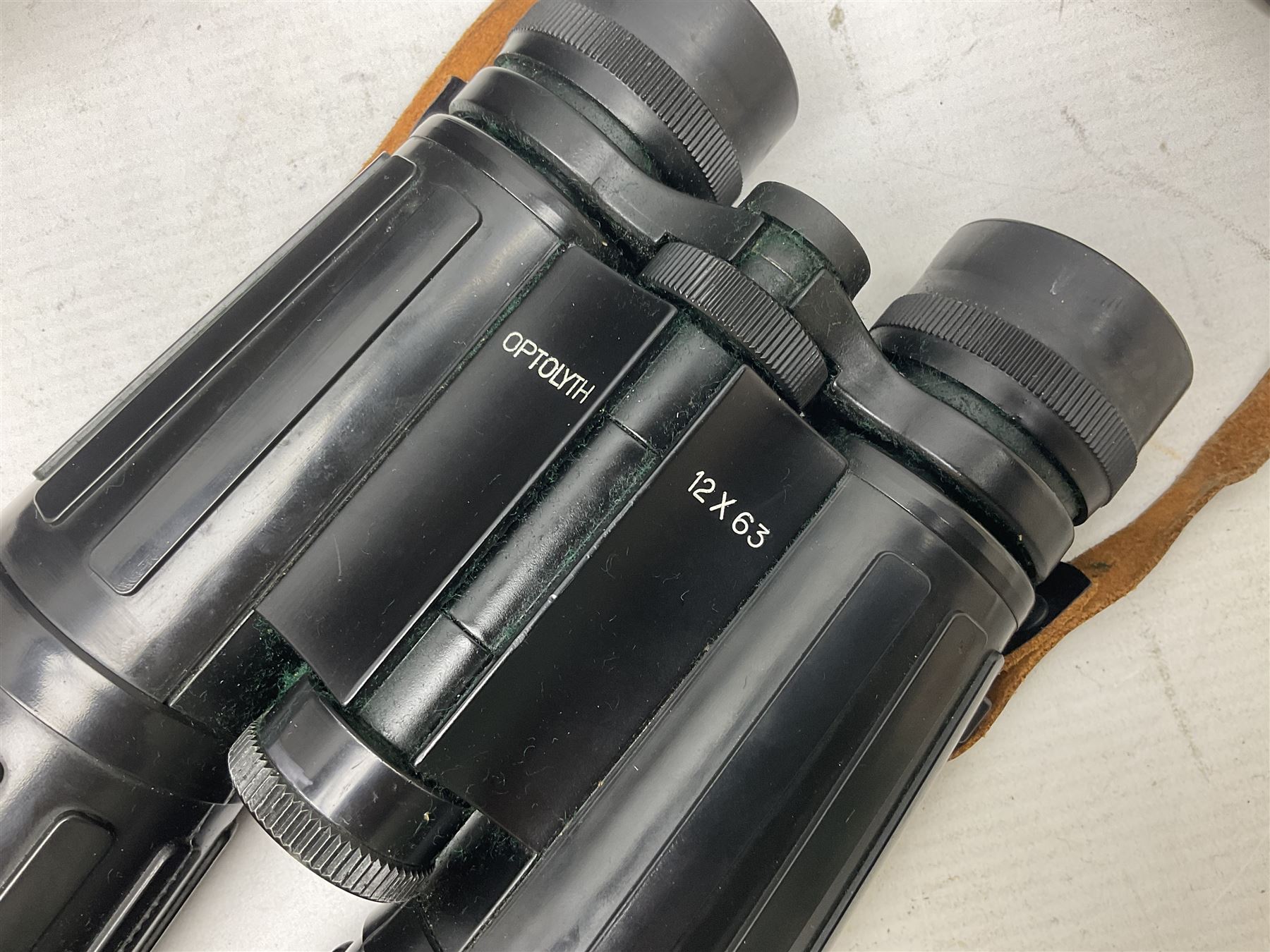 Pair of Optolyth 12 x 63 binoculars, made in Germany, serial no 82186, in leather case