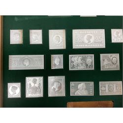 The Stamps of Royalty collection consisting of twenty-five sterling silver hallmarked stamp replicas, housed in a fitted wooden display case, with certificates, polishing cloth and certificates