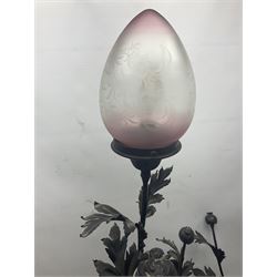 Pair of Art Nouveau style spelter figural table lamps, each mounted on rouge marble effect circular bases, with toleware flower heads and leafy decoration surrounding a female figure, H90cm