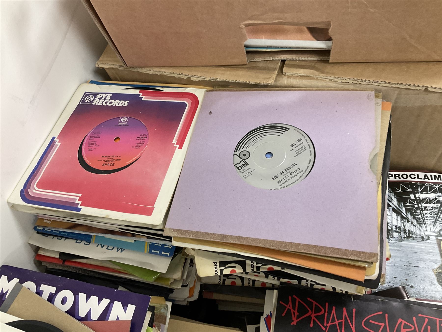 Large quantity of vinyl LPs to include Madonna, ABBA, The Carpenters etc, together with a quantity of 45rpm records, to include approx nine The Beatles The Singles Collection examples etc