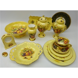  Fifteen pieces of Aynsley 'Orchard Gold' pattern table ware and decorative ceramics including pair two handled urn shaped vases & covers, pedestal fruit bowl, trio of plates, two cups & saucers, brooch etc and a continental porcelain plate (16)  