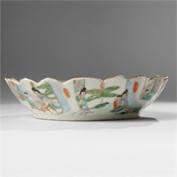 Chinese Kangxi period famille verte bowl, painted with seven figures in a pavilion interior, in Cantonese style border with foliate rim, the exterior painted with similar scenes, D24cm