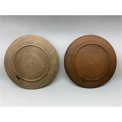 Pair of late 19th century Watcombe terracotta plates, each of circular form each hand painted with the head of a dog, each indistinctly signed C. Greeme?, with impressed marks beneath, D27cm