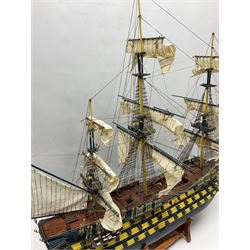 20th century scratch built wooden model of HMS Victory on wooden stand, H75cm, L95cm
