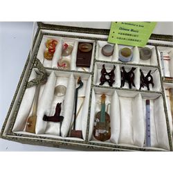 Chinese boxed collection of miniature polished hardstone musical instruments with hardwood stands
