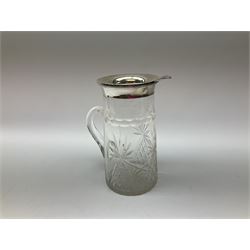 Edwardian silver mounted cut glass water jug, the silver rim hallmarked London, possibly 1904, hallmarks worn and makers mark indistinct, H21.5cm